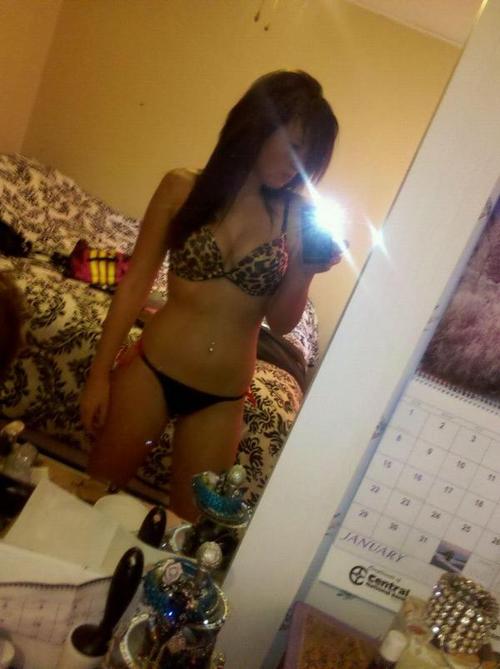 Anonymous in lingerie taking a selfie