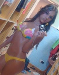 Anonymous in a bikini taking a selfie