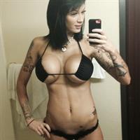 Anonymous in a bikini taking a selfie