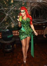 Kim Kardashian as Poison Ivy for the 2011 Midori Green Halloween party in New York