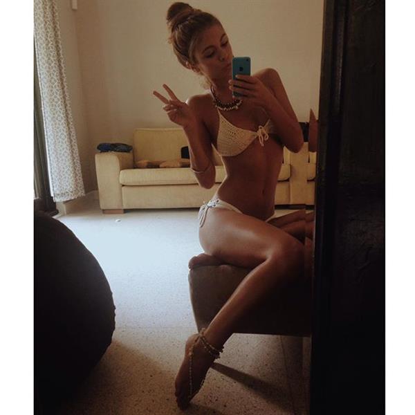 Carmella Rose in a bikini taking a selfie