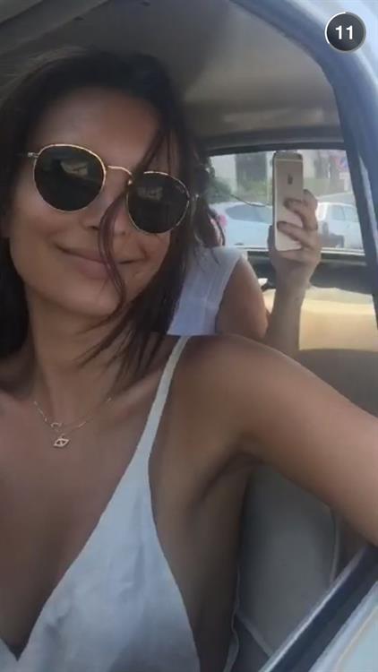 Emily Ratajkowski taking a selfie