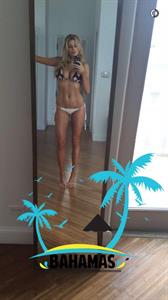 Charlotte McKinney in a bikini taking a selfie