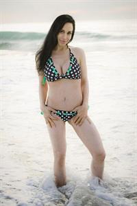 Nadya Suleman is better known as Octomom.  She was born Natalie Denise Suleman on July 11, 1975.  After 14 children she is stripping and making porn...  Here she is in a bikini