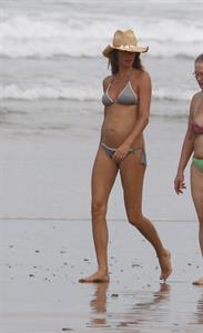A pregnant Gisele Bundchen walking on the beach in Costa Rica - July 23, 2012.  She is pregnant with her second child