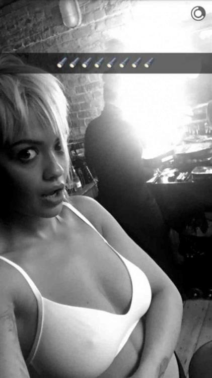 Rita Ora in a bikini taking a selfie