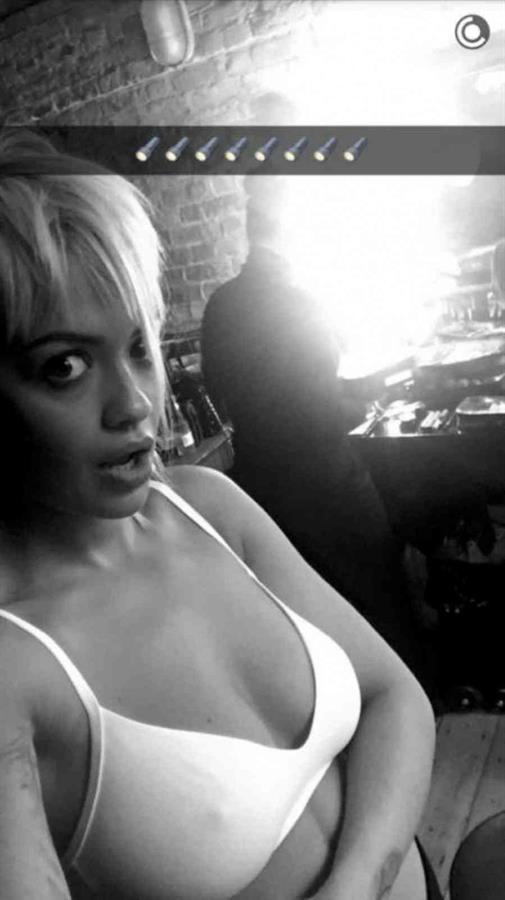 Rita Ora in a bikini taking a selfie