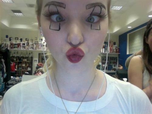 Dove Cameron taking a selfie