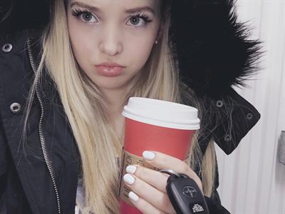 Dove Cameron taking a selfie