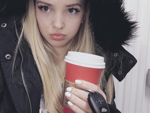 Dove Cameron taking a selfie