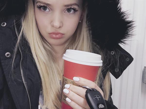 Dove Cameron taking a selfie