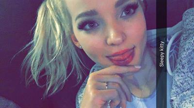 Dove Cameron taking a selfie