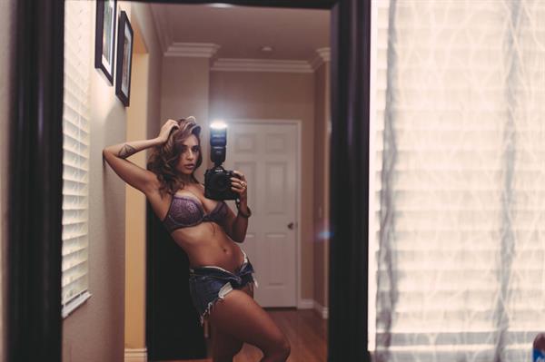 Tianna Gregory in a bikini taking a selfie