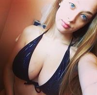 Anonymous in a bikini taking a selfie