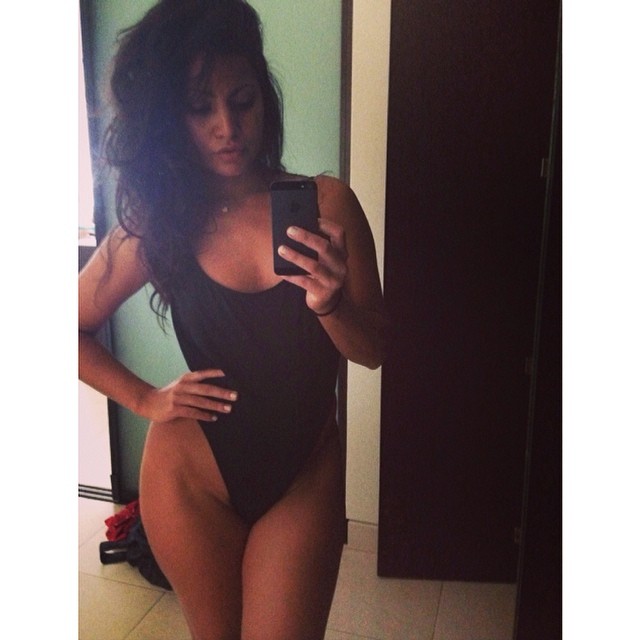 Mónica Alvarez in a bikini taking a selfie