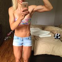 Adrienne Koleszár in a bikini taking a selfie