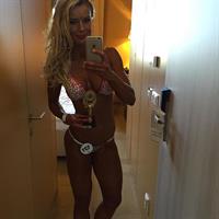 Adrienne Koleszár in a bikini taking a selfie