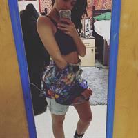 Sasha Lane taking a selfie