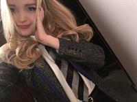 Dove Cameron taking a selfie