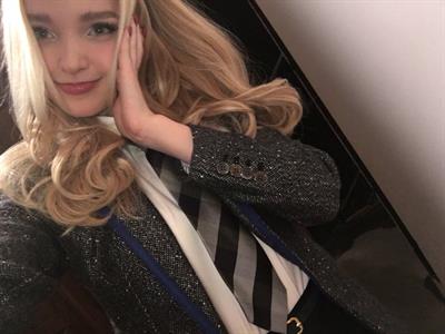 Dove Cameron taking a selfie