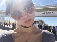 Dove Cameron taking a selfie