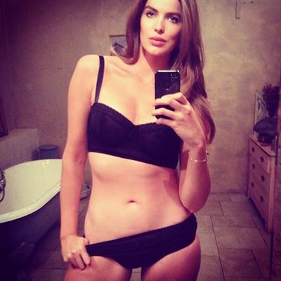 Robyn Lawley in a bikini taking a selfie