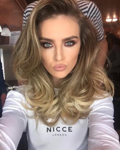 Perrie Edwards taking a selfie