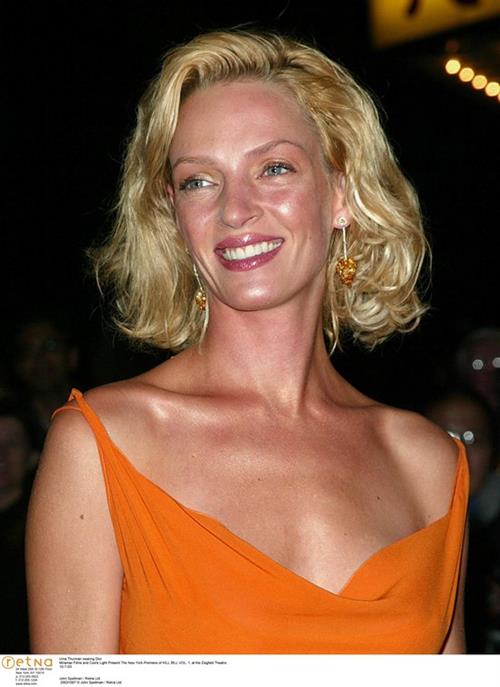 Uma Thurman in an orange dress