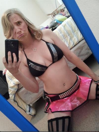Andy in a bikini taking a selfie