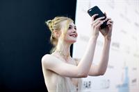 Elle Fanning showing off pasties at amfAR’s 23rd Cinema Against AIDS Gala