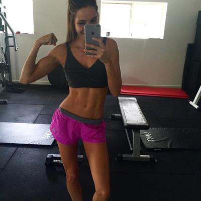 Kayla Itsines taking a selfie