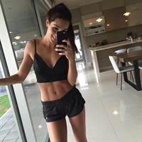 Kayla Itsines taking a selfie
