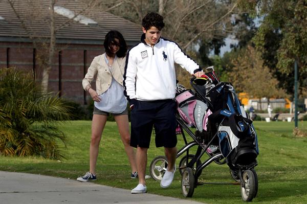 Selena Gomez golfing on February 2, 2010