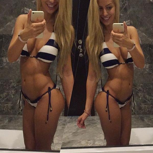 Yanita Yancheva in a bikini taking a selfie