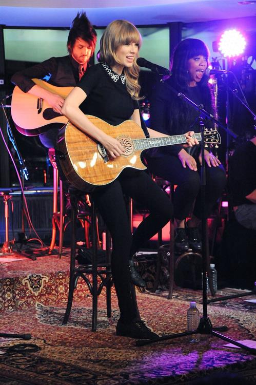 Taylor Swift performs at a private concert for NRJ on a barge on The Seine January 28, 2013 