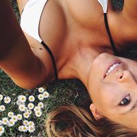 Marisa Papen in a bikini taking a selfie