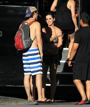 Katy Perry talks with a group of her friends after spending the afternoon at Raging Waters in San Dimas, California on August 12, 2012