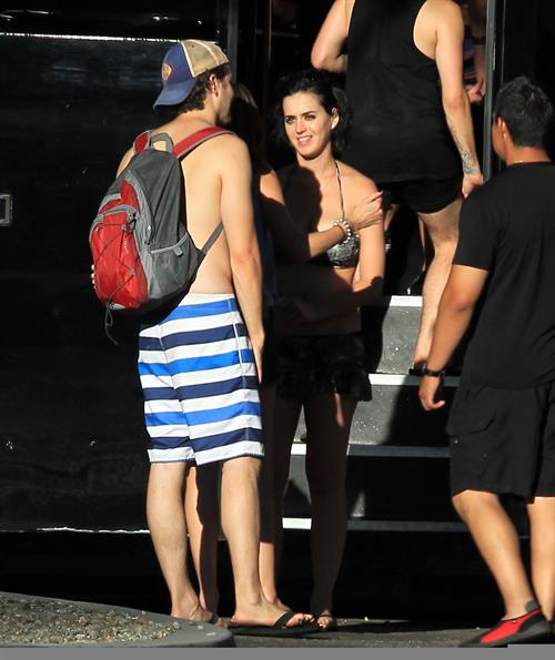 Katy Perry talks with a group of her friends after spending the afternoon at Raging Waters in San Dimas, California on August 12, 2012