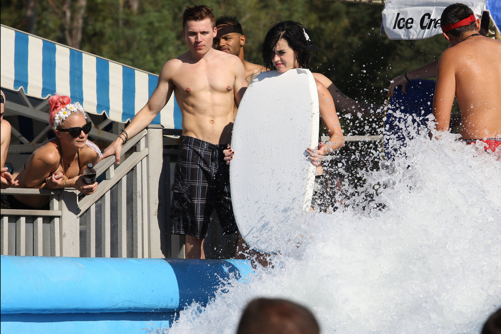 Katy Perry talks with a group of her friends after spending the afternoon at Raging Waters in San Dimas, California on August 12, 2012