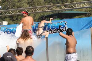 Katy Perry talks with a group of her friends after spending the afternoon at Raging Waters in San Dimas, California on August 12, 2012