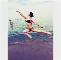 Aliya Mustafina in a bikini