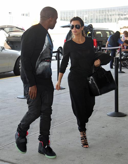 Kim Kardashian and Kanye West JFK airport in New York - 09 August 2012 