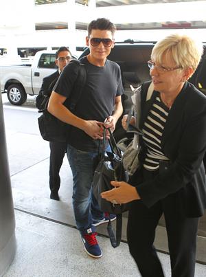Kim Kardashian catches a flight out of Miami October 4, 2012 