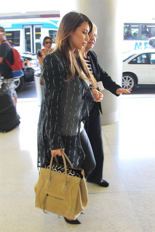 Kim Kardashian catches a flight out of Miami October 4, 2012 