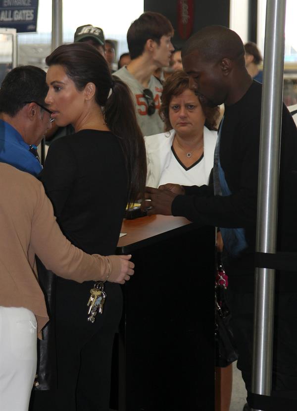 Kim Kardashian - JFK airport in New York on August 9, 2012