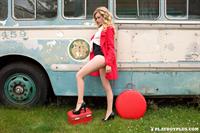 Playboy Cybergirl Olivia Preston poses naked with an old rusted bus