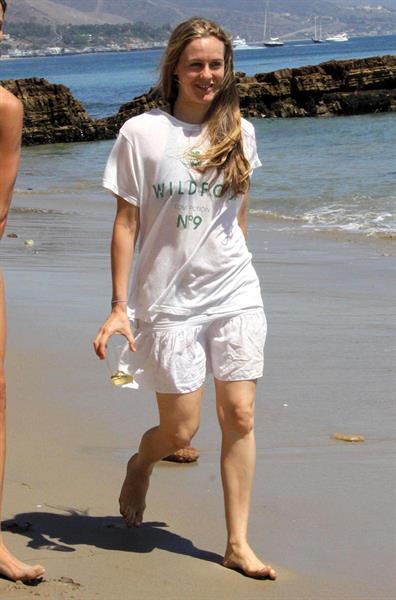 Alicia Silverstone walking on the beach in Malibu 