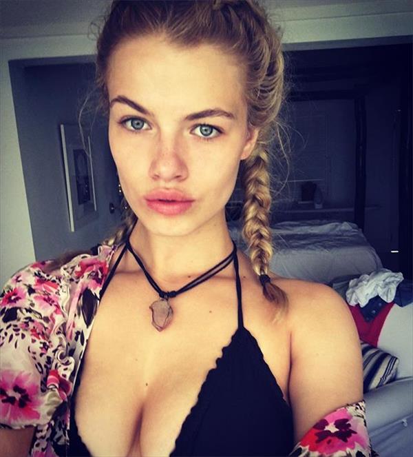 Hailey Clauson in a bikini taking a selfie