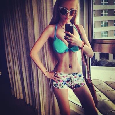 Valeria Lukyanova in a bikini taking a selfie