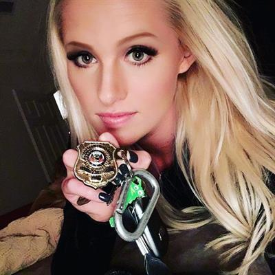 Tomi Lahren taking a selfie